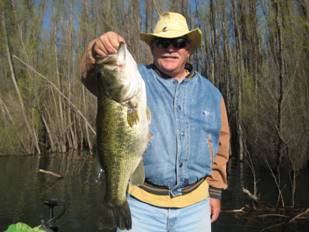 Man holding bass fish